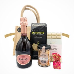 Jutetasche mit Champagner Ruinart Rosé und Snacks